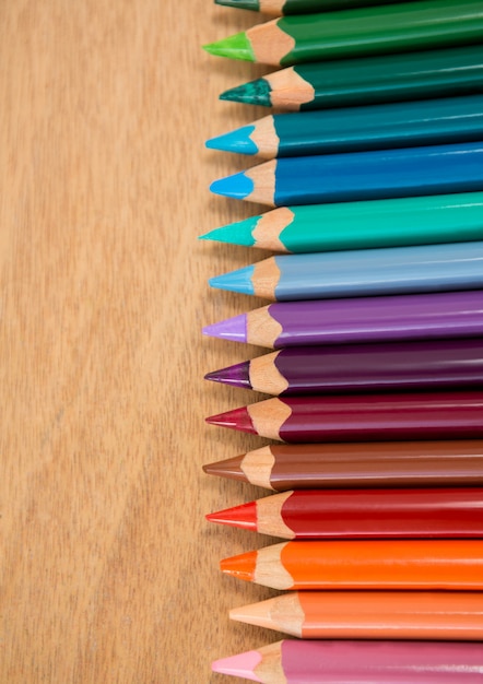 Colored pencils arranged in a row