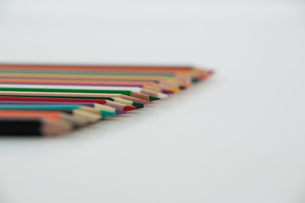 Colored pencils arranged in a row