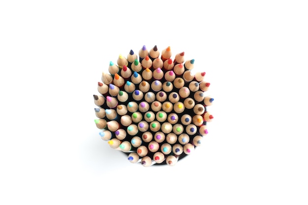 Colored pencils circle on white background from above