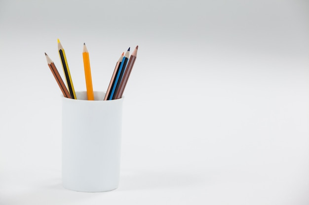 Colored pencils kept in cup