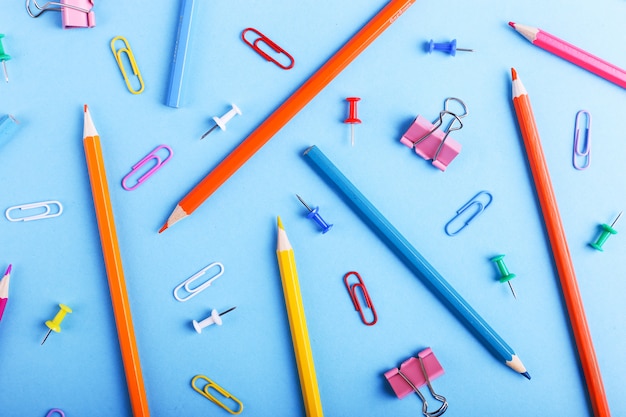 Colored pencils, paper clips and pins