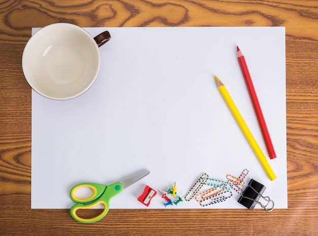 Photo colored pencils with paper on table