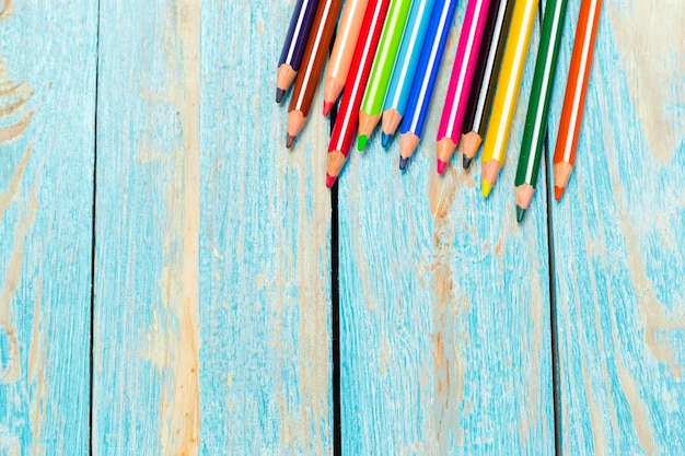 Colored pencils on a wooden board