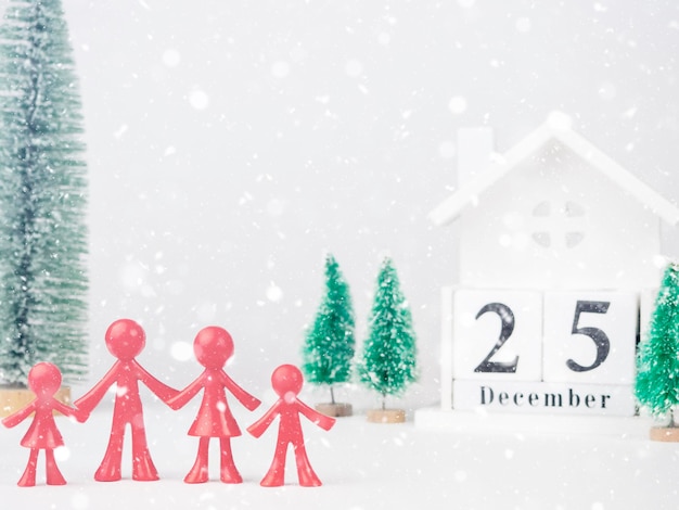 Colored people on the background of the calendar with the date December 25 The concept of Christmas