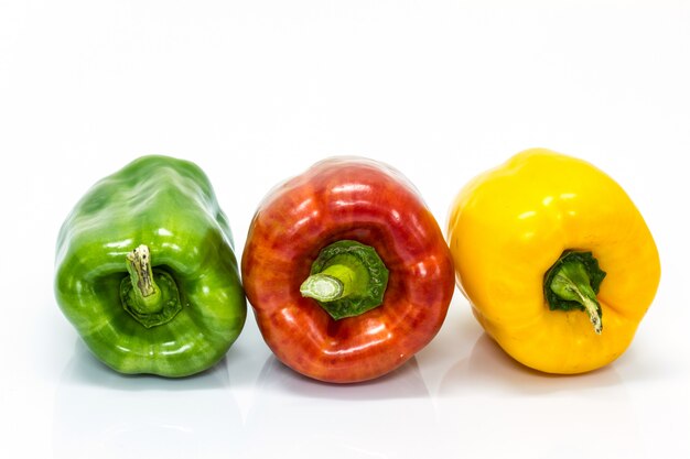 Colored peppers over white background