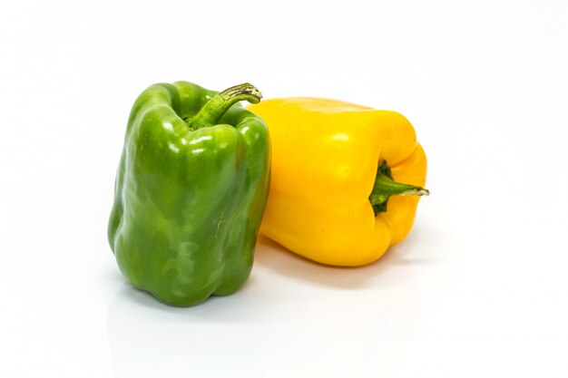 Colored peppers over white background