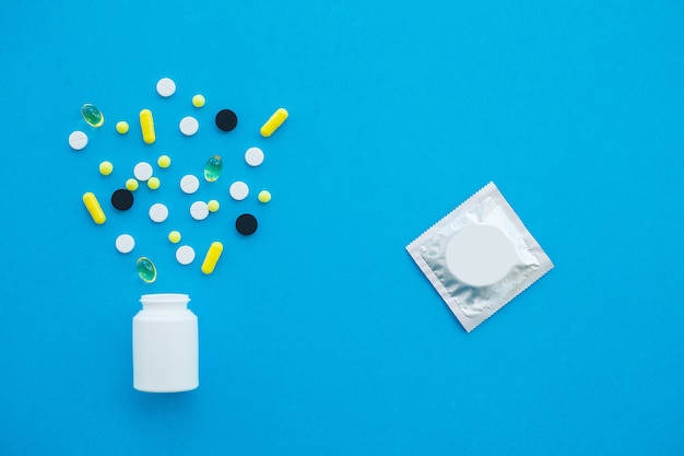 Colored Pills And Capsule On Blue Background