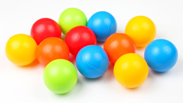 Colored plastic balls on white background