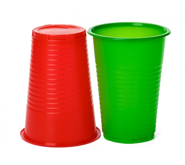 Colored plastic cups on white background