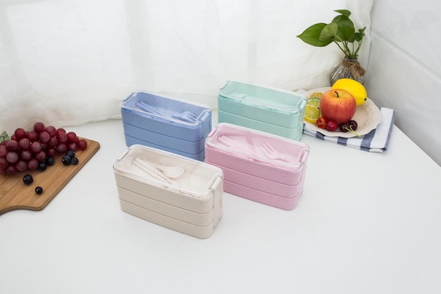 Colored plastic lunchboxes on the table