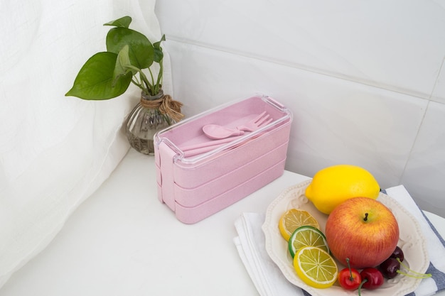 Colored plastic lunchboxes on the table