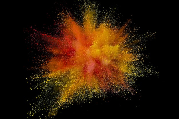 Colored powder explosion. Abstract closeup dust on backdrop. Colorful explode. Paint holi