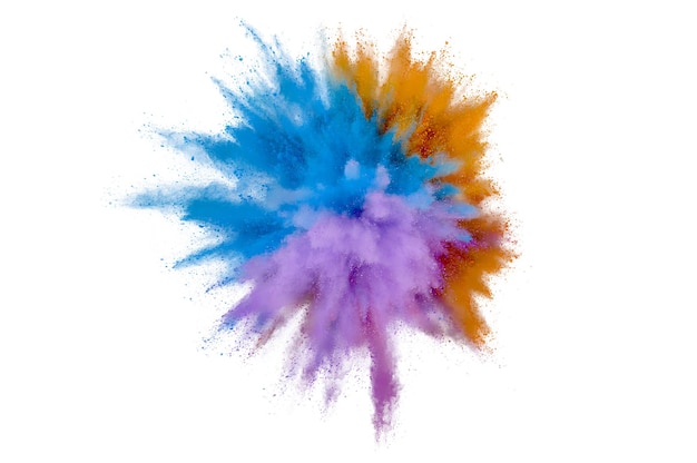 Colored powder explosion on white background. Abstract closeup dust on backdrop. Colorful explode. Paint holi