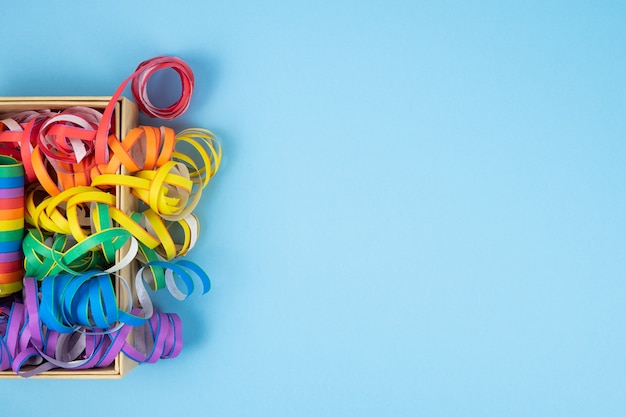 Colored ribbons on blue background. Colorful spirals LGBTQIA culture.