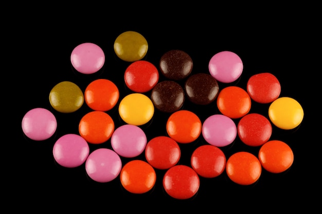 Colored round chocolates or chewing gum