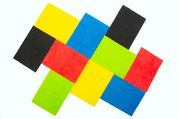 Colored samples of felt porous material on a white\
background