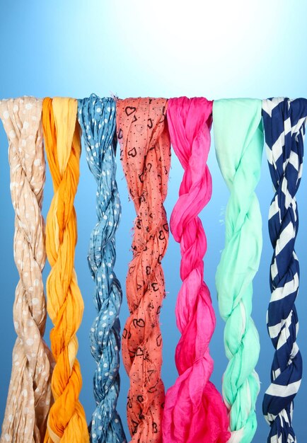 Photo colored scarves on blue background