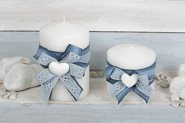 Colored and scented candle on wooden background. ideal gift for Christmas, Easter, Valentine's Day