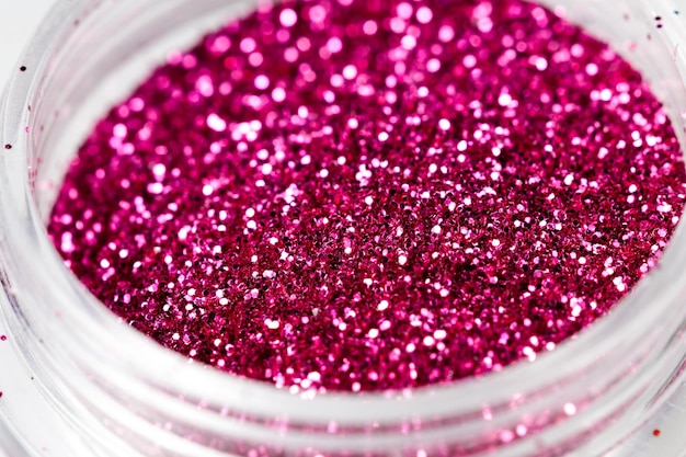 Colored sequins in a plastic jar closeup