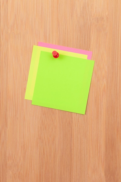 Colored Sticky Notes Pinned to the Wooden Message Board