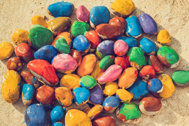 Colored stones lying on a flat surface