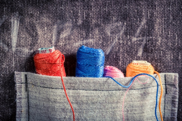 Colored threads in the pocket of the mat tailor