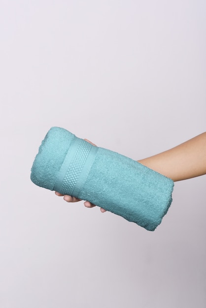 Colored towel on human hands