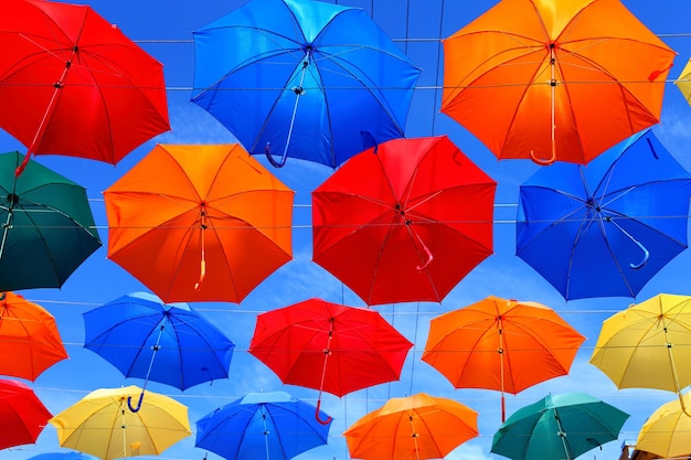 Colored umbrellas on the background of blue sky. High quality photo