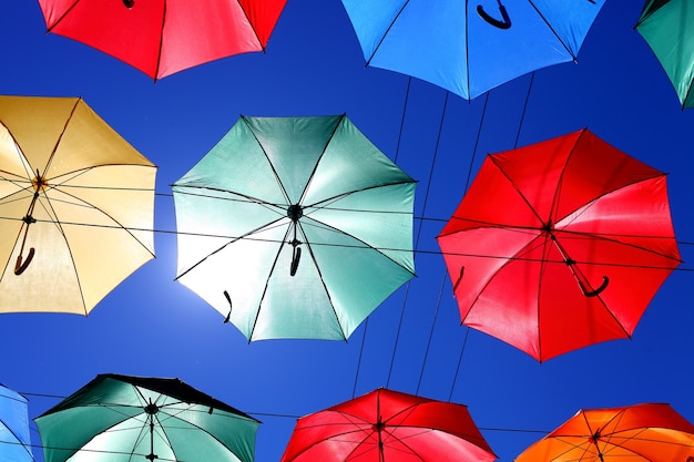 Colored umbrellas on the background of blue sky. High quality photo