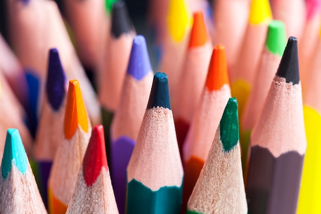 Colored wooden pencils with a different color lead for drawing and creativity