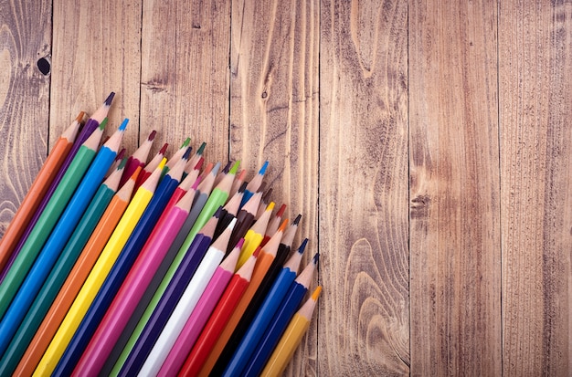 Colored wooden pencils, on a wooden base.