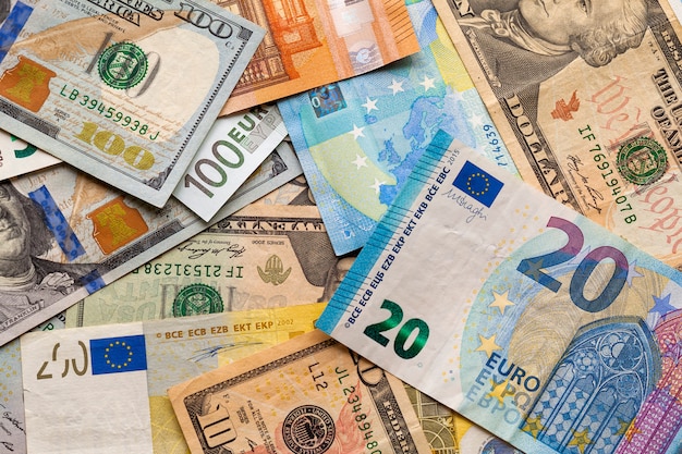 Colorful abstract background of different banknotes., Ukrainian national currency bills, American dollars and euro. Money and finances, succesful investment concept.