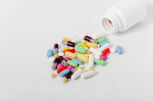 colorful assorted pharmaceutical pills, tablets, capsules and bottle.