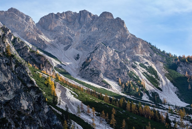 Colorful autumn evening alpine rock scene