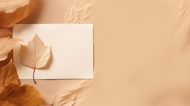 Photo a colorful autumn leaf is neatly aligned next to an empty paper sheet creating a perfect setting for seasonal notes or artistic endeavors