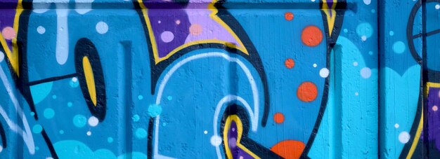 Colorful background of graffiti painting artwork with bright aerosol outlines on wall old school