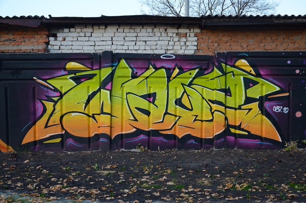 Colorful background of graffiti painting artwork with bright aerosol outlines on wall old school