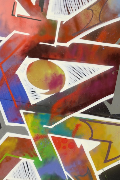 Colorful background of graffiti painting artwork with bright aerosol strips on metal wall