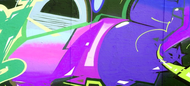 Colorful background of graffiti painting artwork with bright aerosol strips on metal wall