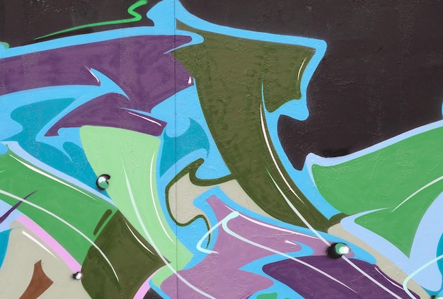 Colorful background of graffiti painting artwork with bright aerosol strips on metal wall