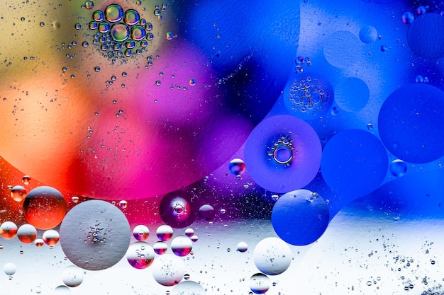 A colorful background with bubbles and a blue and red background.