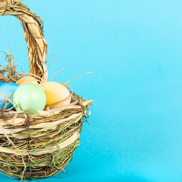 Colorful background with Easter eggs on blue background. Happy Easter concept