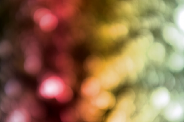 Colorful background with natural bokeh texture and defocused sparkling lights. 