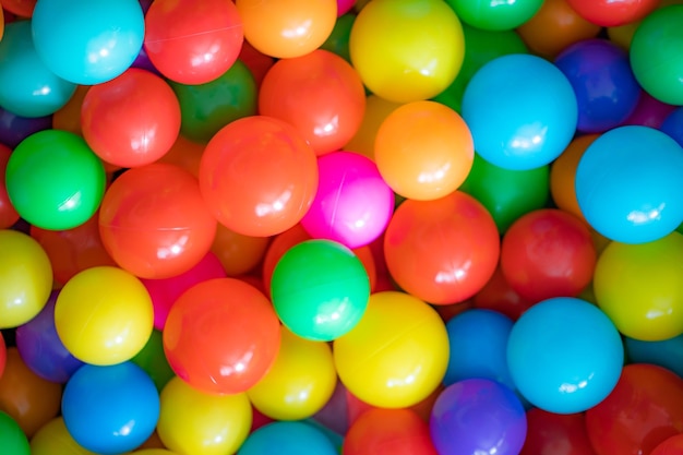 colorful ball background - many colorful plastic balls for kids in a playground