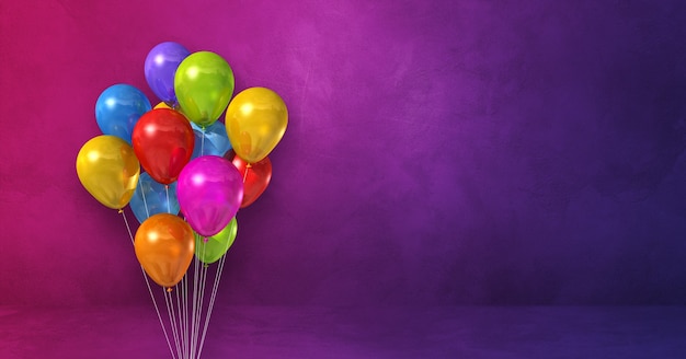 Colorful balloons bunch on a purple surface