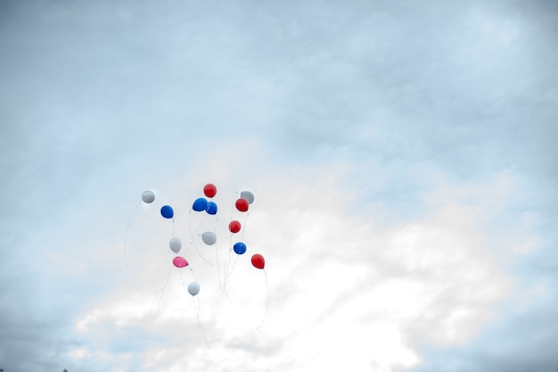 Colorful balloons fly into the sky. the concept of liberation and freedom.