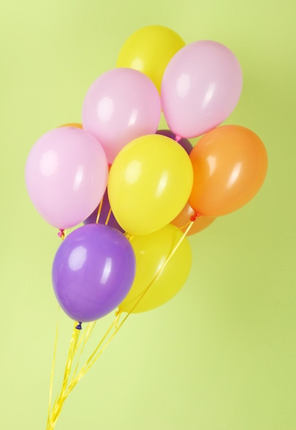 Colorful balloons on green background