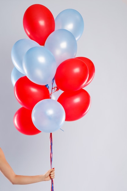 Colorful balloons isolated on gray background