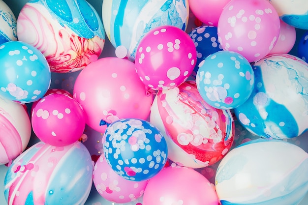 Colorful balloons on pastel color background. Festive or birthday party concept.   