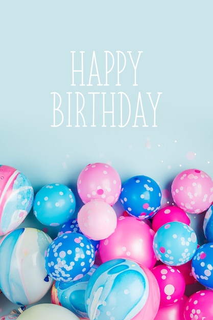 Colorful balloons on pastel color background. Festive or birthday party concept